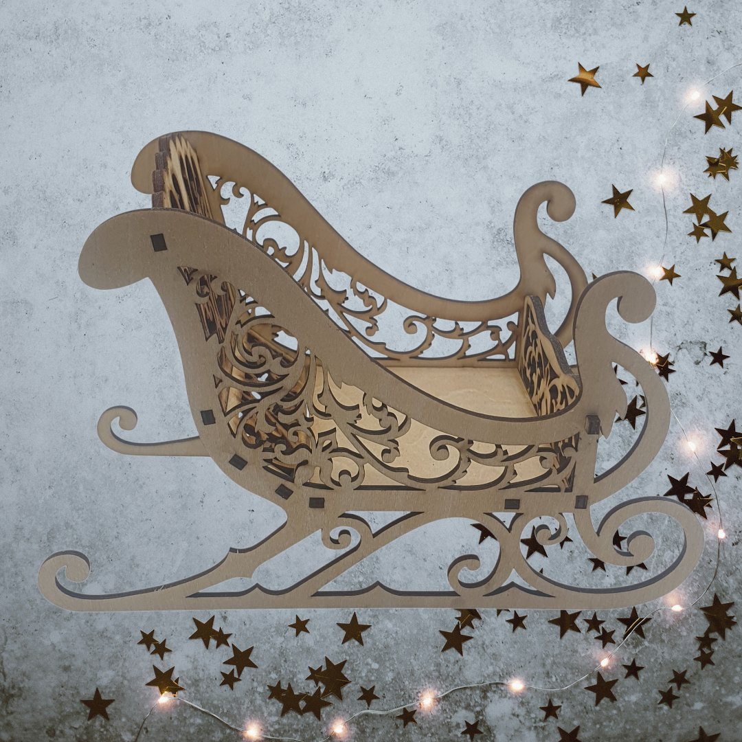 Decorative sleigh with intricate patterns, Wooden Santa Sleigh – Laser-Cut DIY Christmas Craft Kit