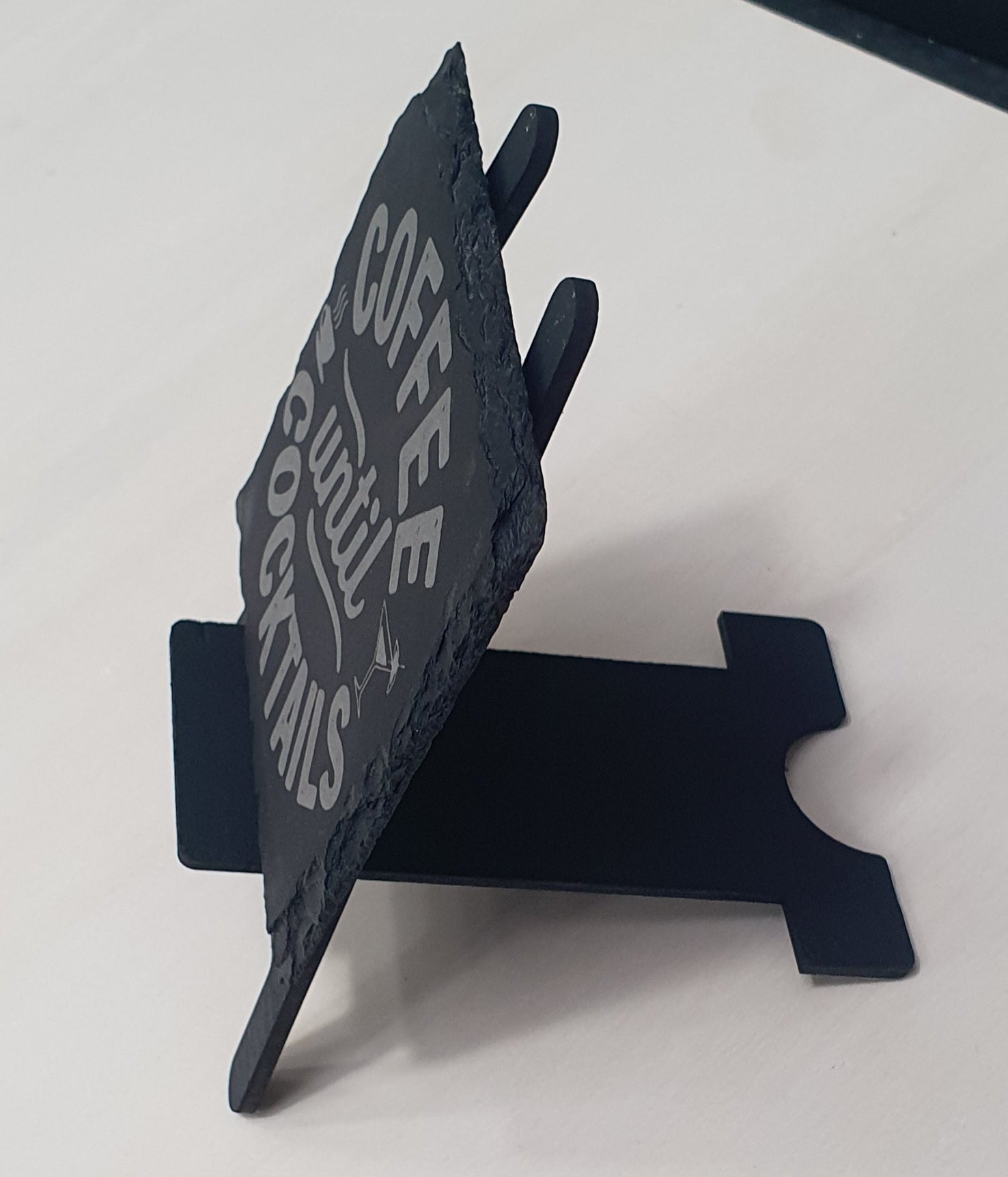Black Easel Tile/Slate Coaster Stand with slate coaster on it.