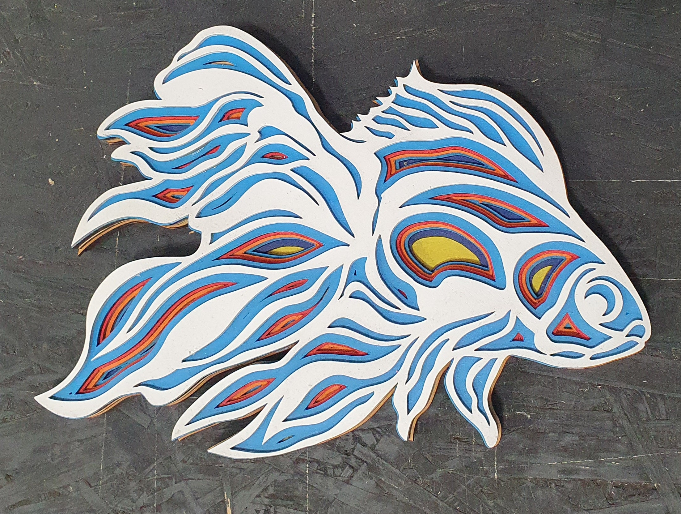 3D wooden fish artwork featuring multi-layer wavy pattern design