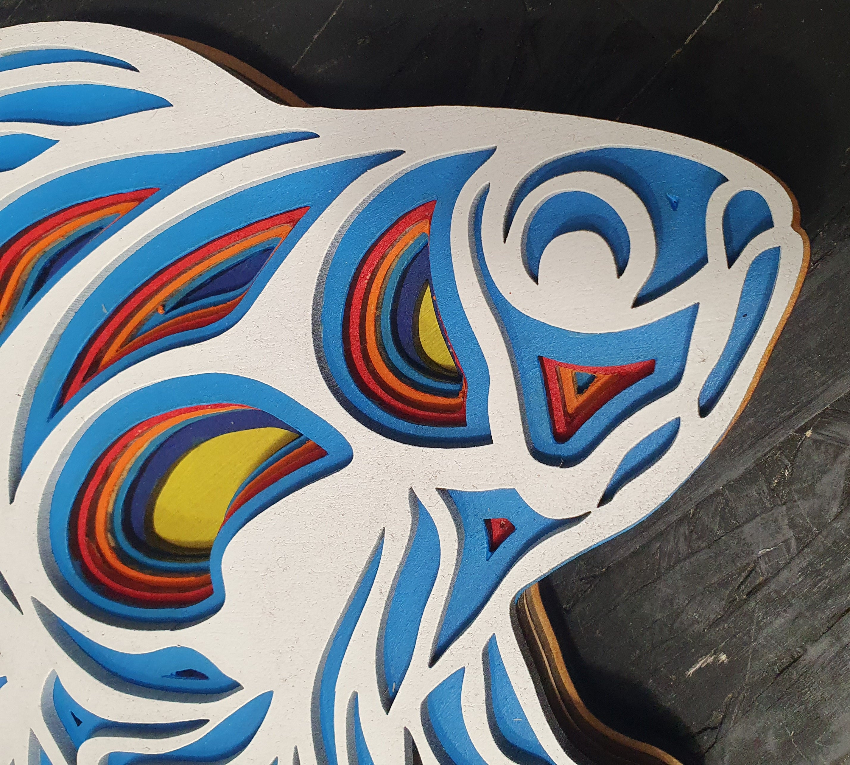 Handcrafted multi-layer fish wall art with wave-inspired patterns