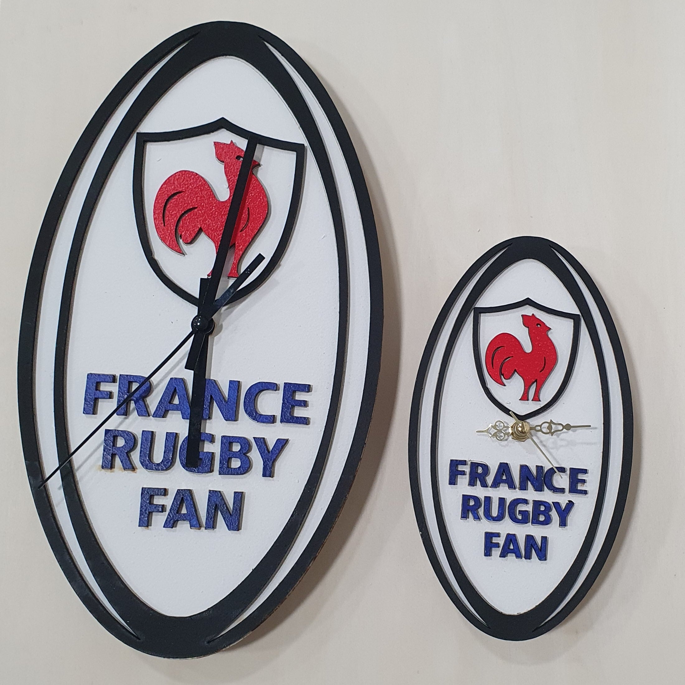 Rugby fan desk and wall clocks shaped like a rugby ball with team-inspired graphics