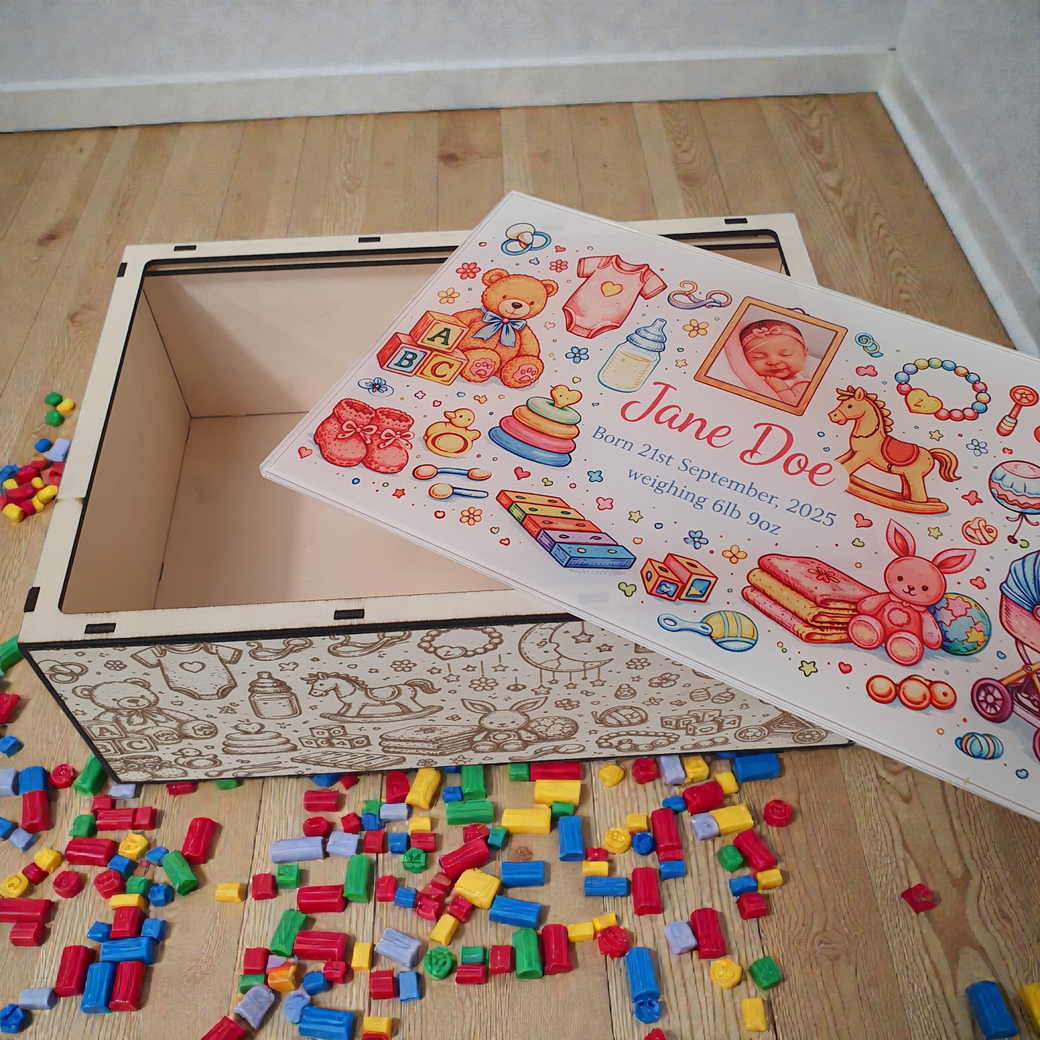 Laser engraved wooden baby memory box with illustrated side details