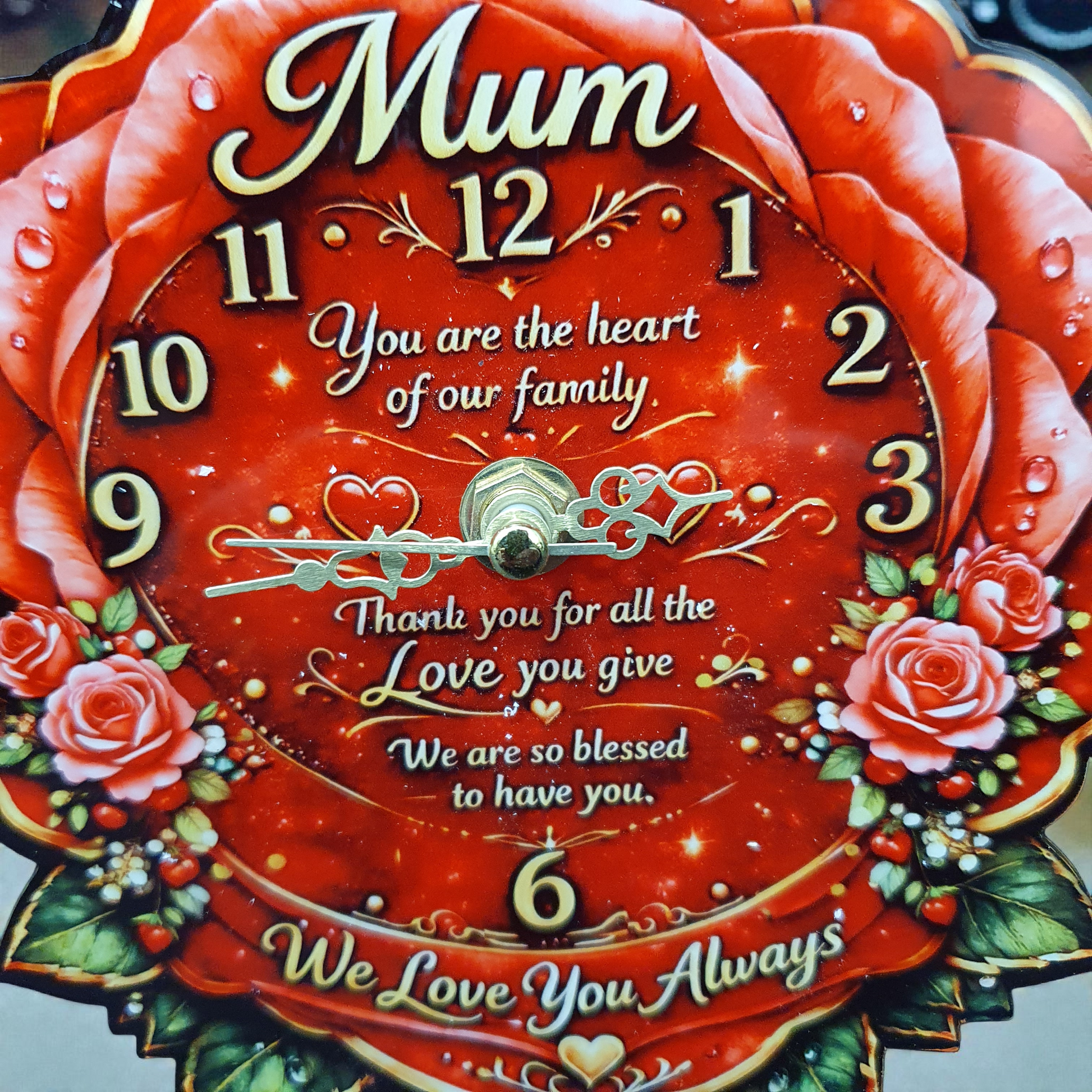 Decorative rose Mum desk clock displayed on shelf, vibrant red flowers and gold accents, thoughtful gift for mum for any special occasion.