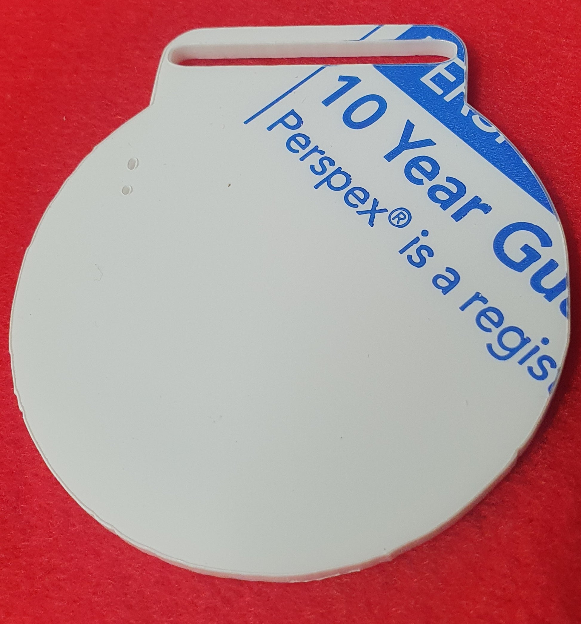 Clear acrylic medal blank suitable for sublimation, vinyl and UV printing, ideal for personalised sports and school awards.