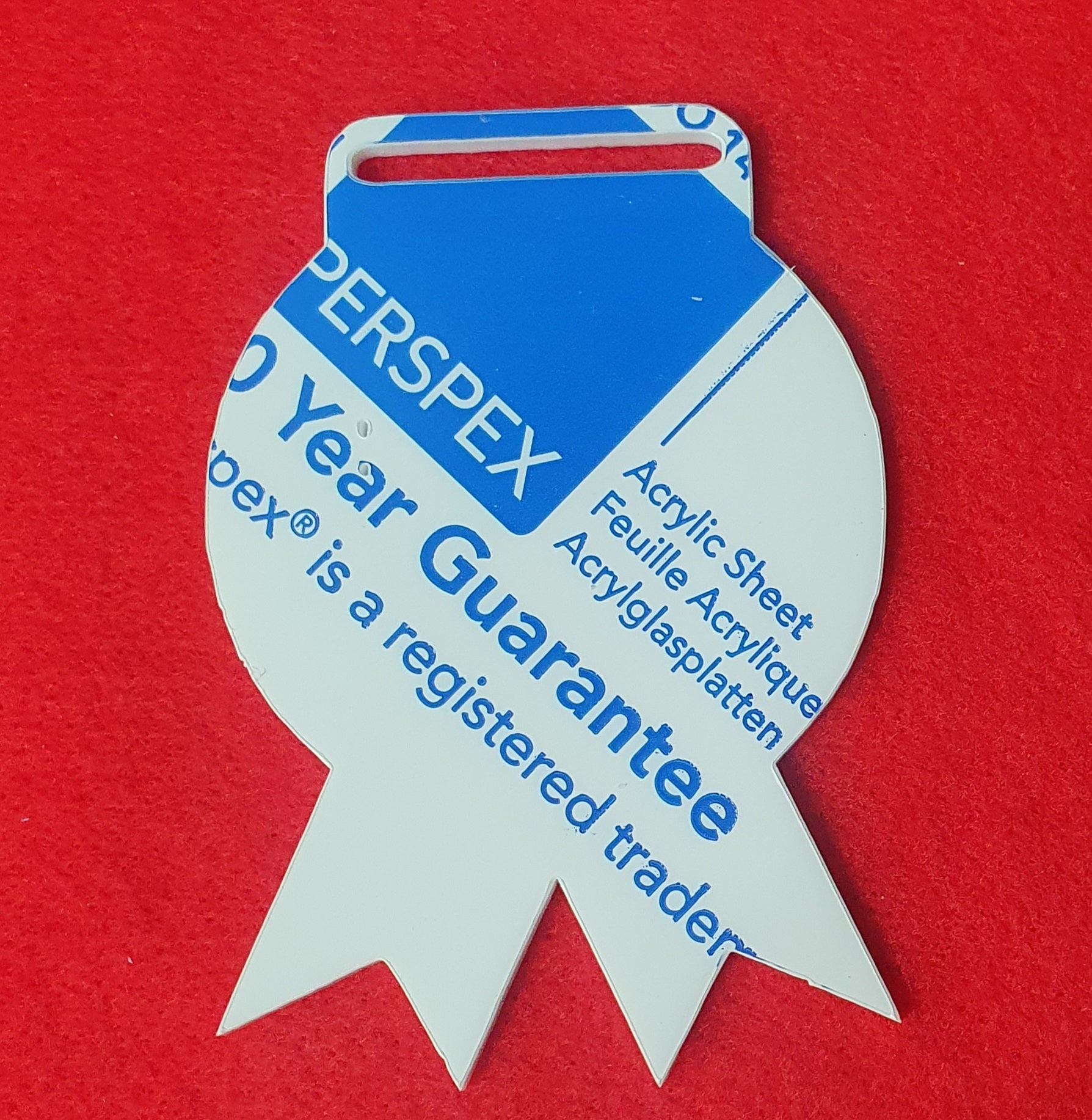 White acrylic ribbon shaped award blank suitable for sublimation, vinyl and UV printing for personalised event medals.