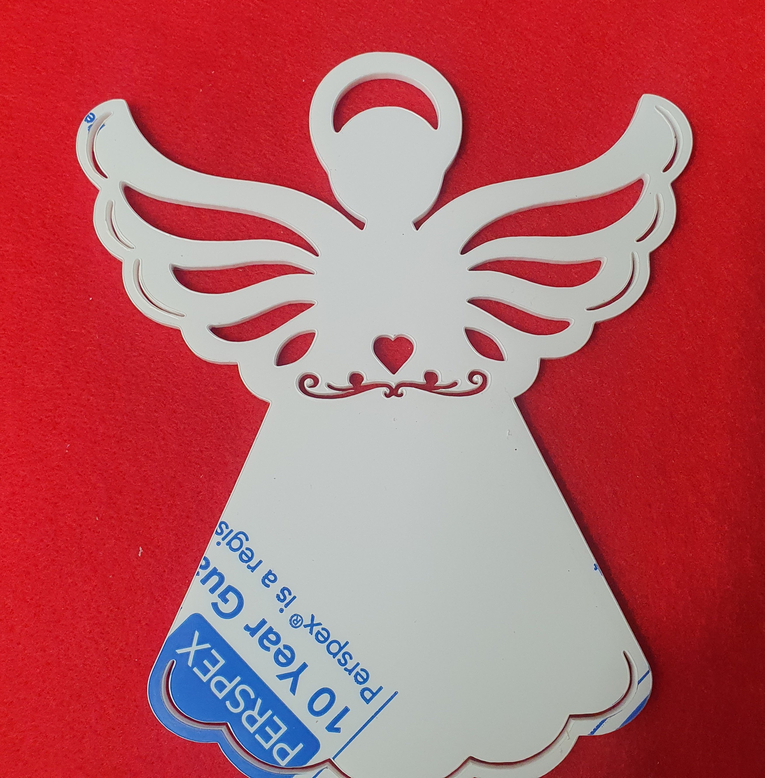 White acrylic angel memorial stake close up showing smooth laser cut edges suitable for vinyl, sublimation and engraving.