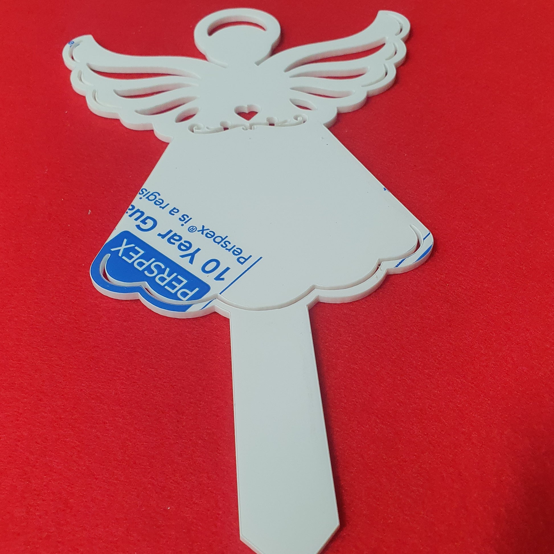 3mm cast acrylic angel grave marker measuring 25cm x 15cm with detailed wings, heart cut-out and integrated ground stake.