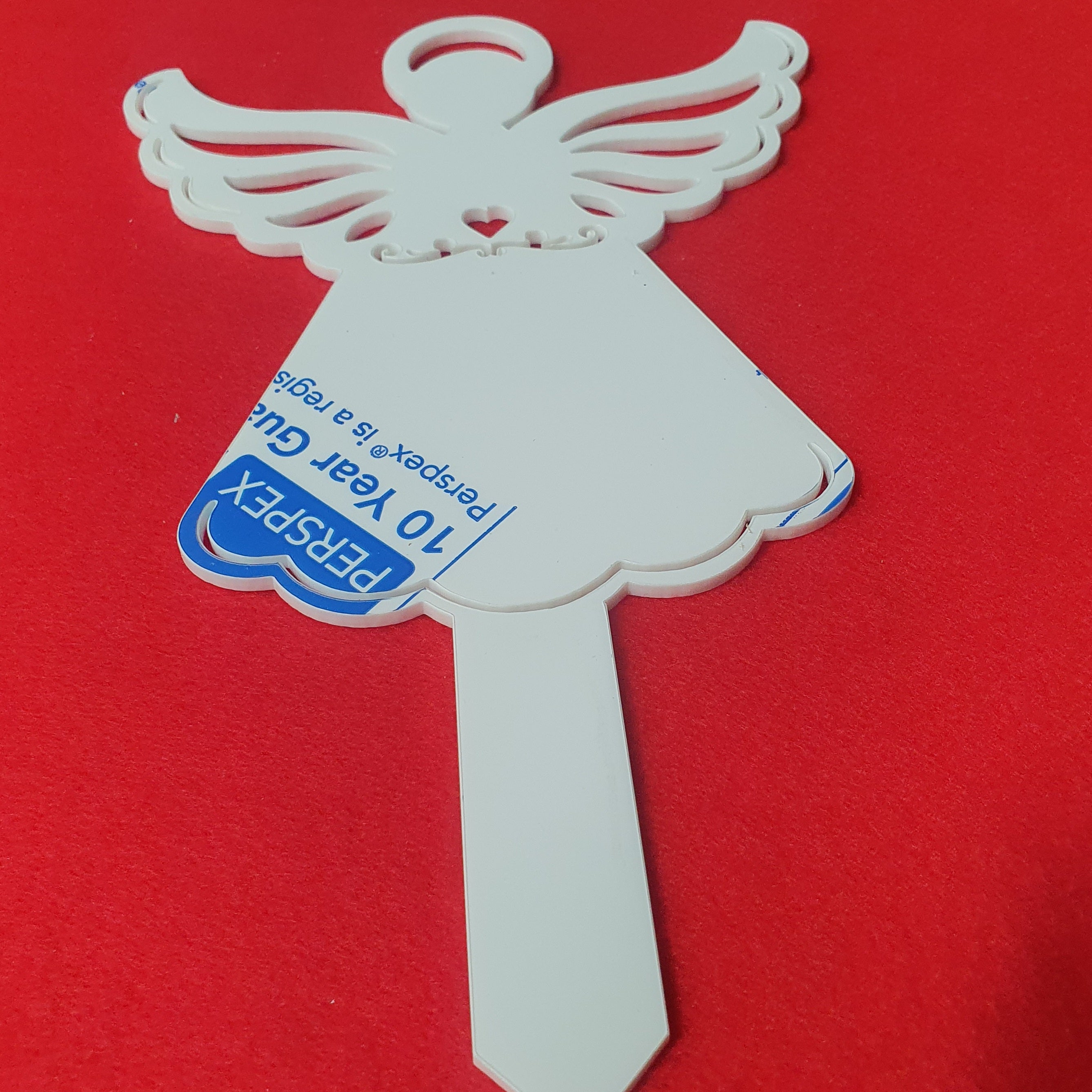 3mm cast acrylic angel grave marker measuring 25cm x 15cm with detailed wings, heart cut-out and integrated ground stake.