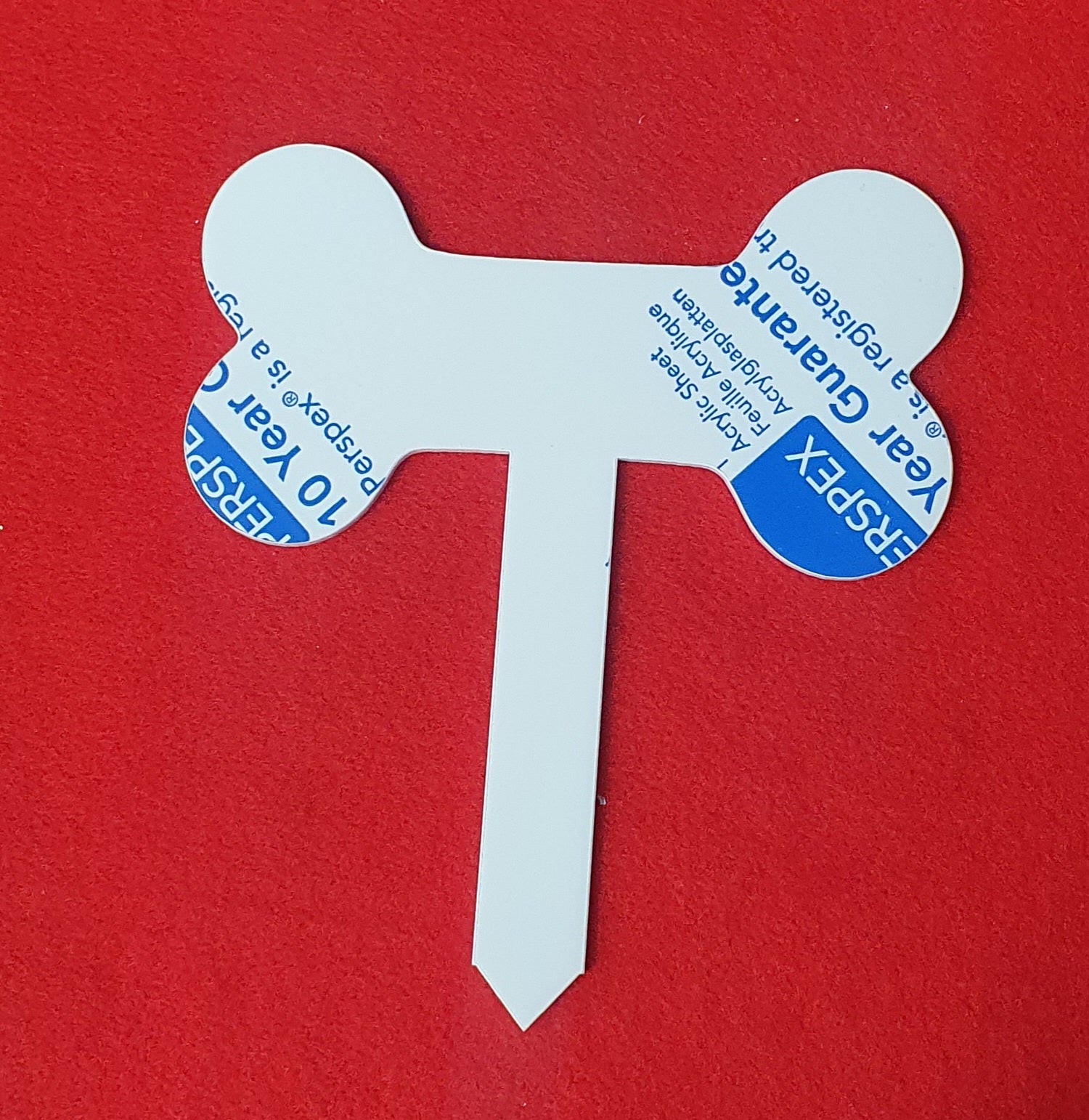 3mm cast acrylic dog bone grave marker measuring 16cm x 14cm with integrated ground stake for garden memorial use.