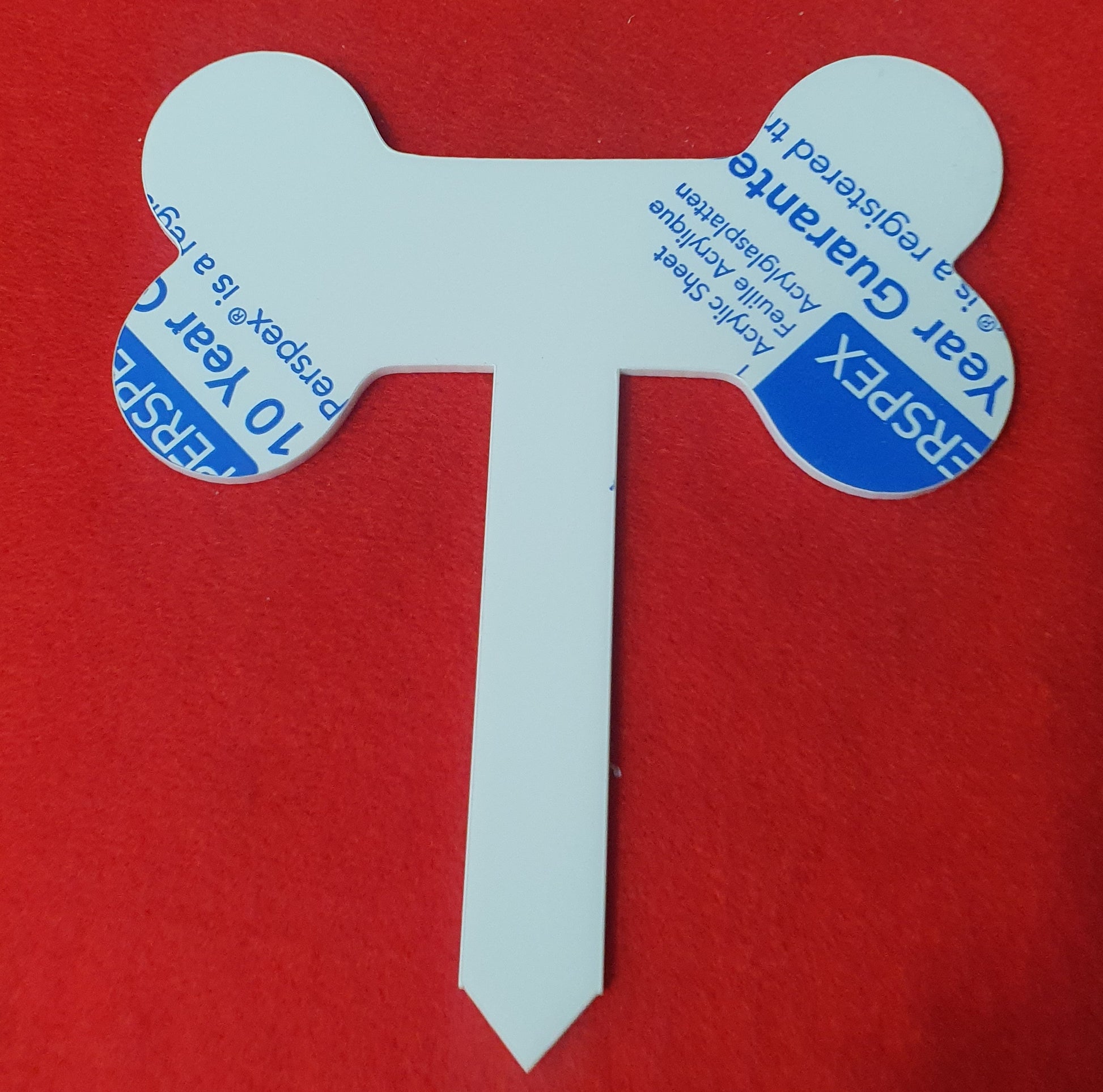 White acrylic pet memorial stake close up showing smooth laser cut edges suitable for vinyl, sublimation and engraving.