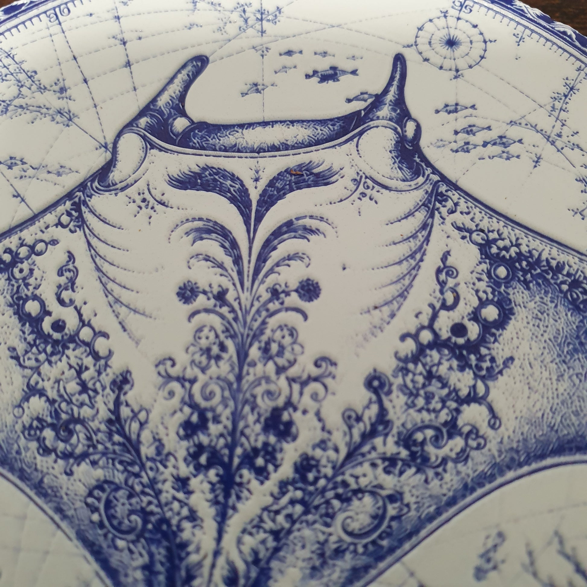 Set of six ceramic sea creature coasters featuring cobalt blue illustrations of ocean animals with cork backing.