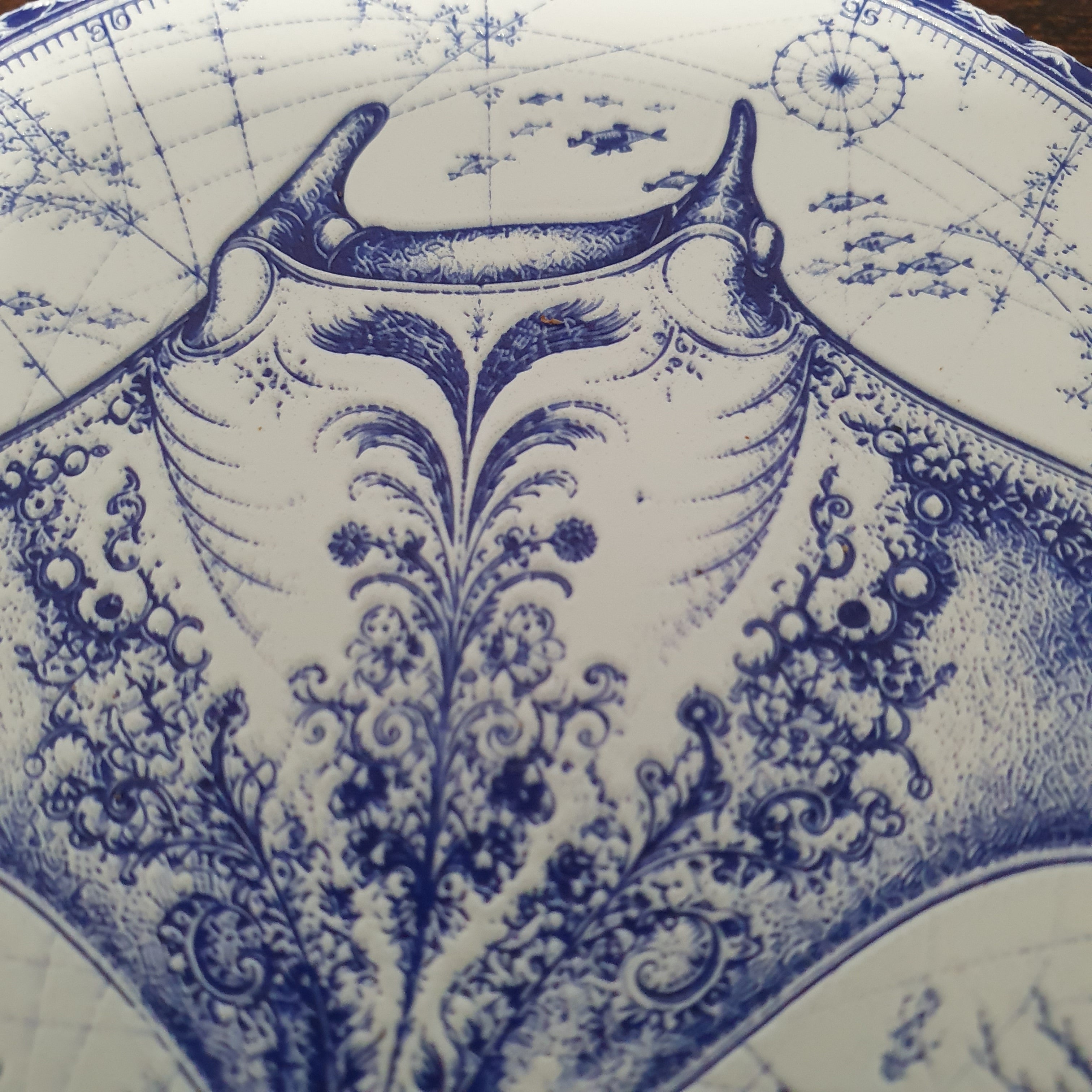 Set of six ceramic sea creature coasters featuring cobalt blue illustrations of ocean animals with cork backing.