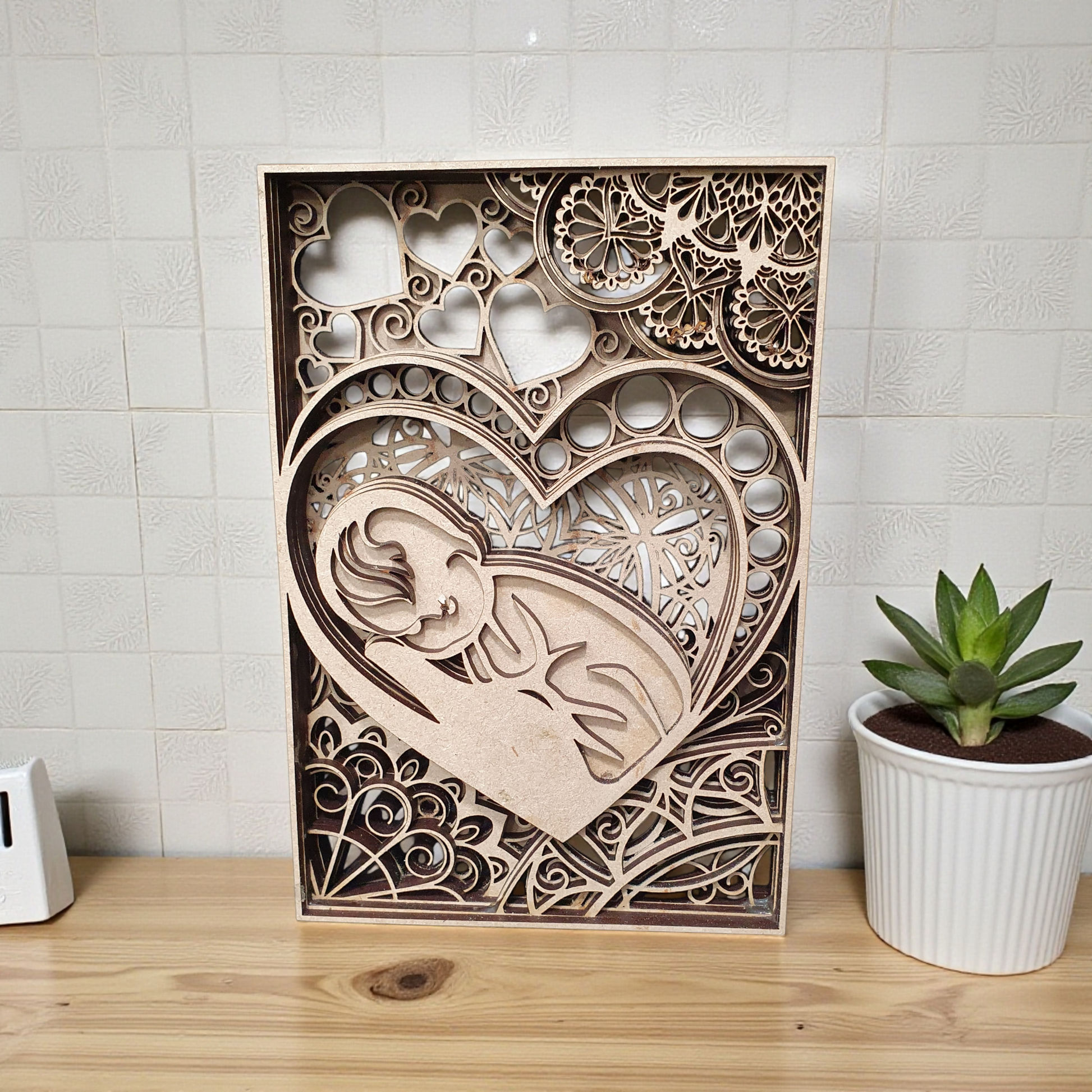 3D layered baby and heart silhouette décor available in multiple sizes