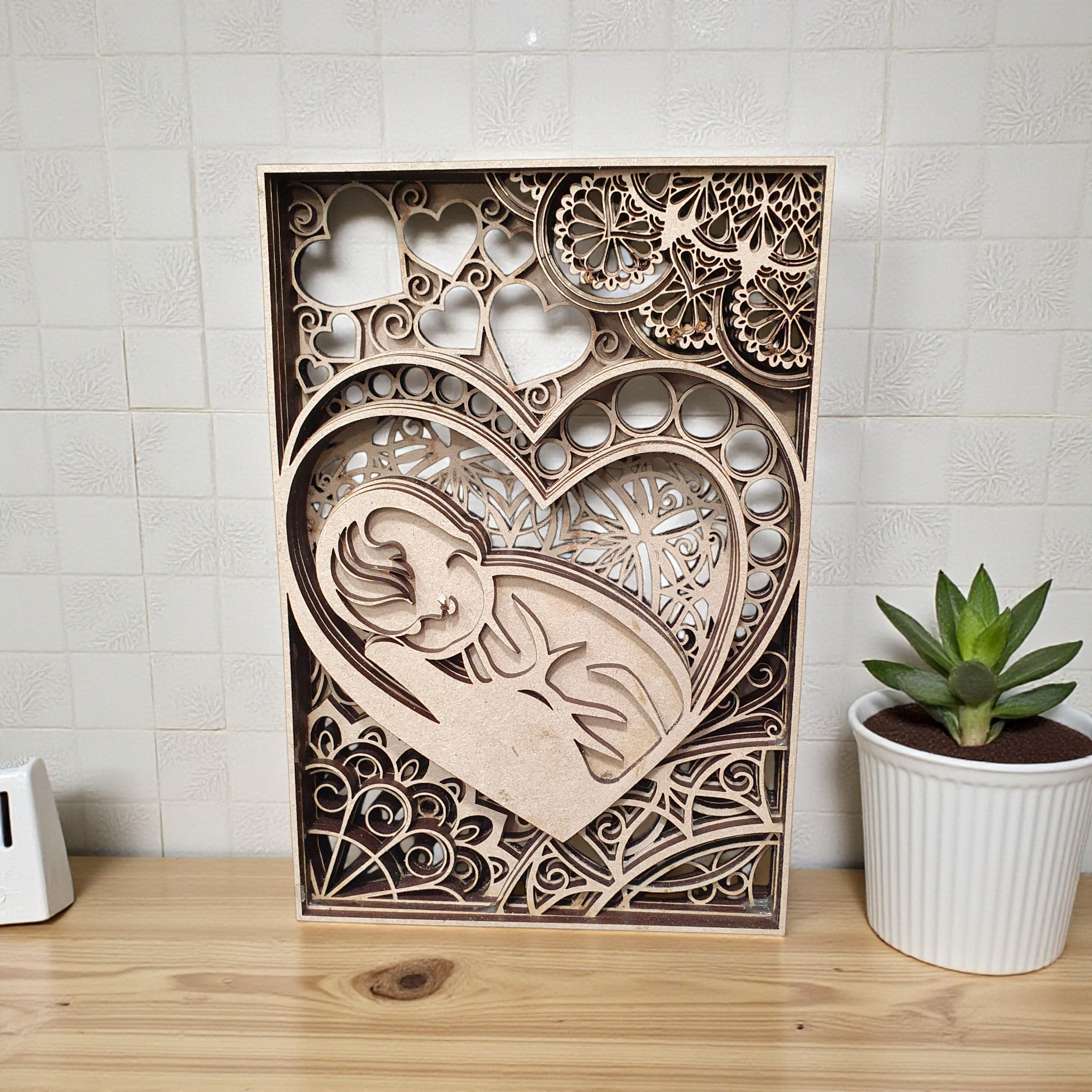 3D layered baby and heart silhouette décor available in multiple sizes