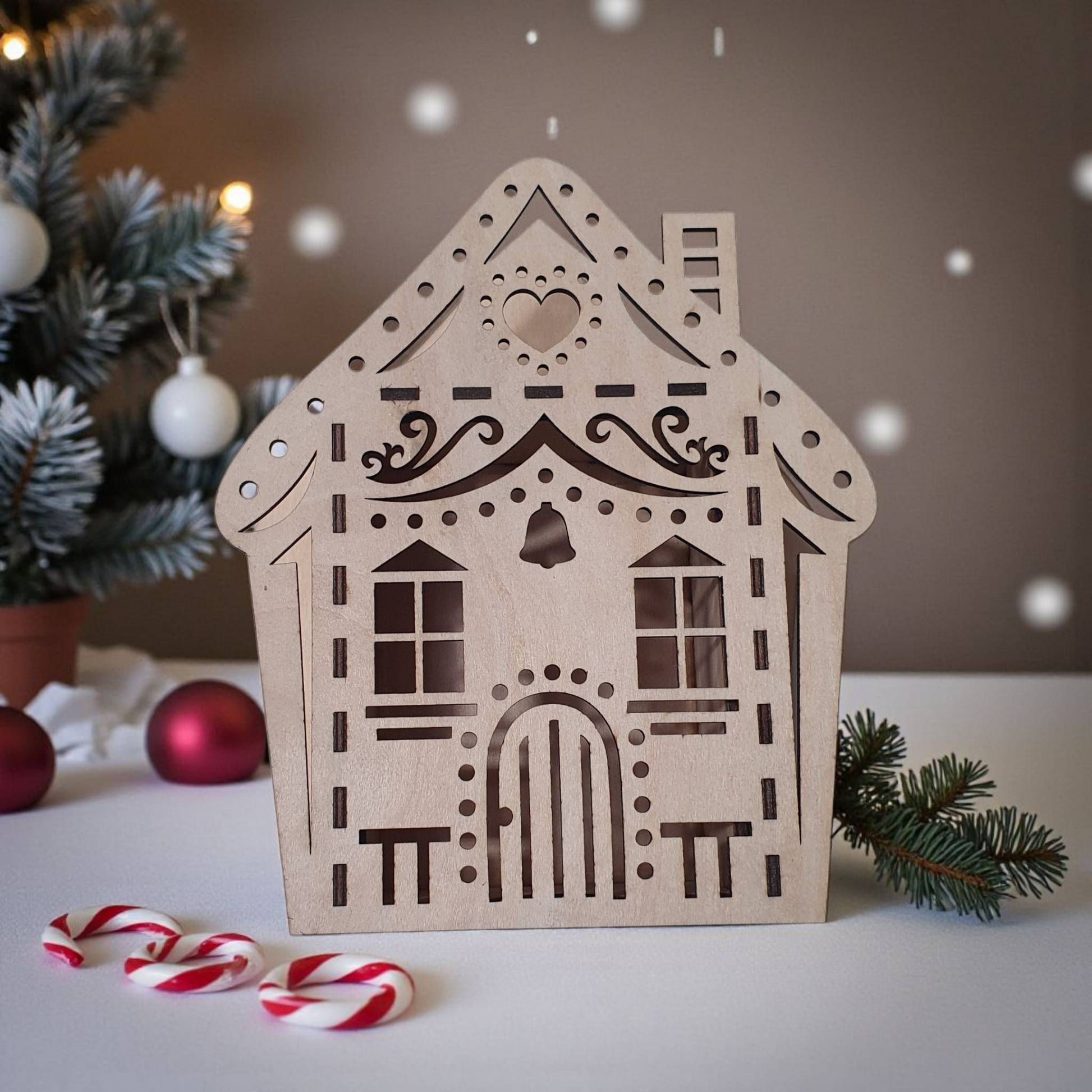 Decorative wooden house-shaped lantern with Christmas decorations in the background