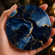 Navy blue marble effect acrylic coaster with gold veining and cork backing featuring luxurious dark blue abstract marble design.