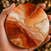 Terracotta marble effect acrylic coaster with gold veining and cork backing in warm orange and cream abstract design.
