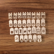 Laser-cut MDF Christmas gift tags with festive designs including Santa and snowflakes