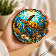 Sea turtle themed coaster set displaying four unique marine life illustrations inspired by stained glass art with bright coral reefs, seashells and tropical ocean colours, perfect for coastal home décor.