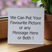 White Tile with custom text or picture  on a wooden surface with a plant in the background
