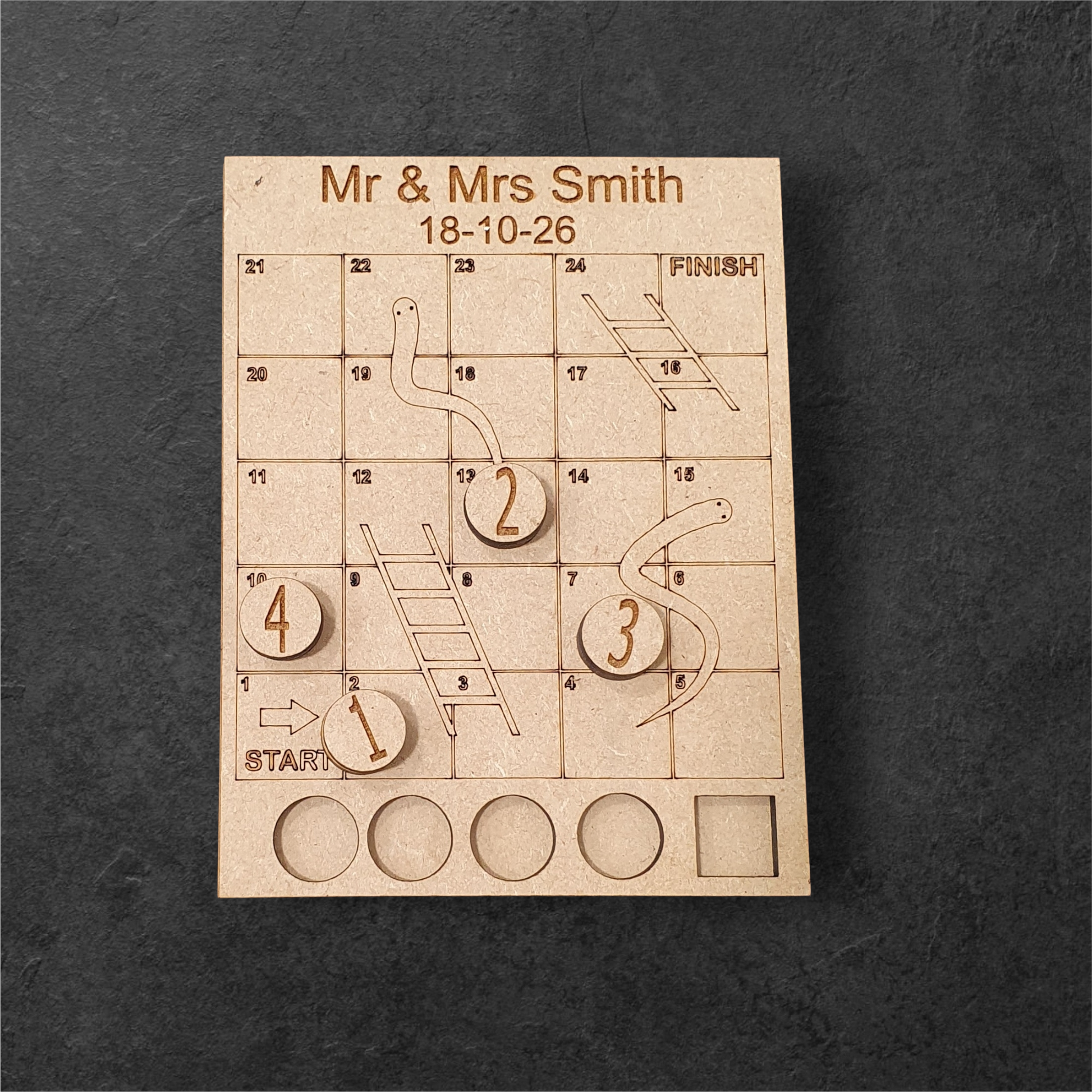 Rustic wooden wedding favours in organza bags with engraved tabletop games