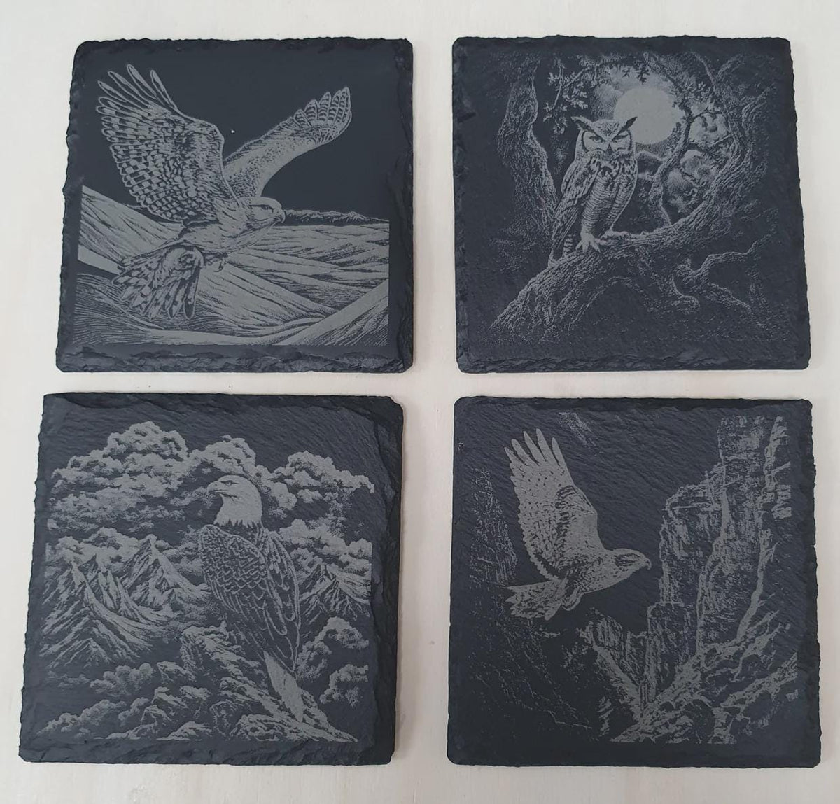 4-piece laser-engraved birds of prey slate tile set featuring eagle, owl, falcon and kestrel designs on premium natural slate. Wildlife themed stone tile décor set, nature lover gift, birdwatcher present, decorative coasters or wall art for rustic home décor