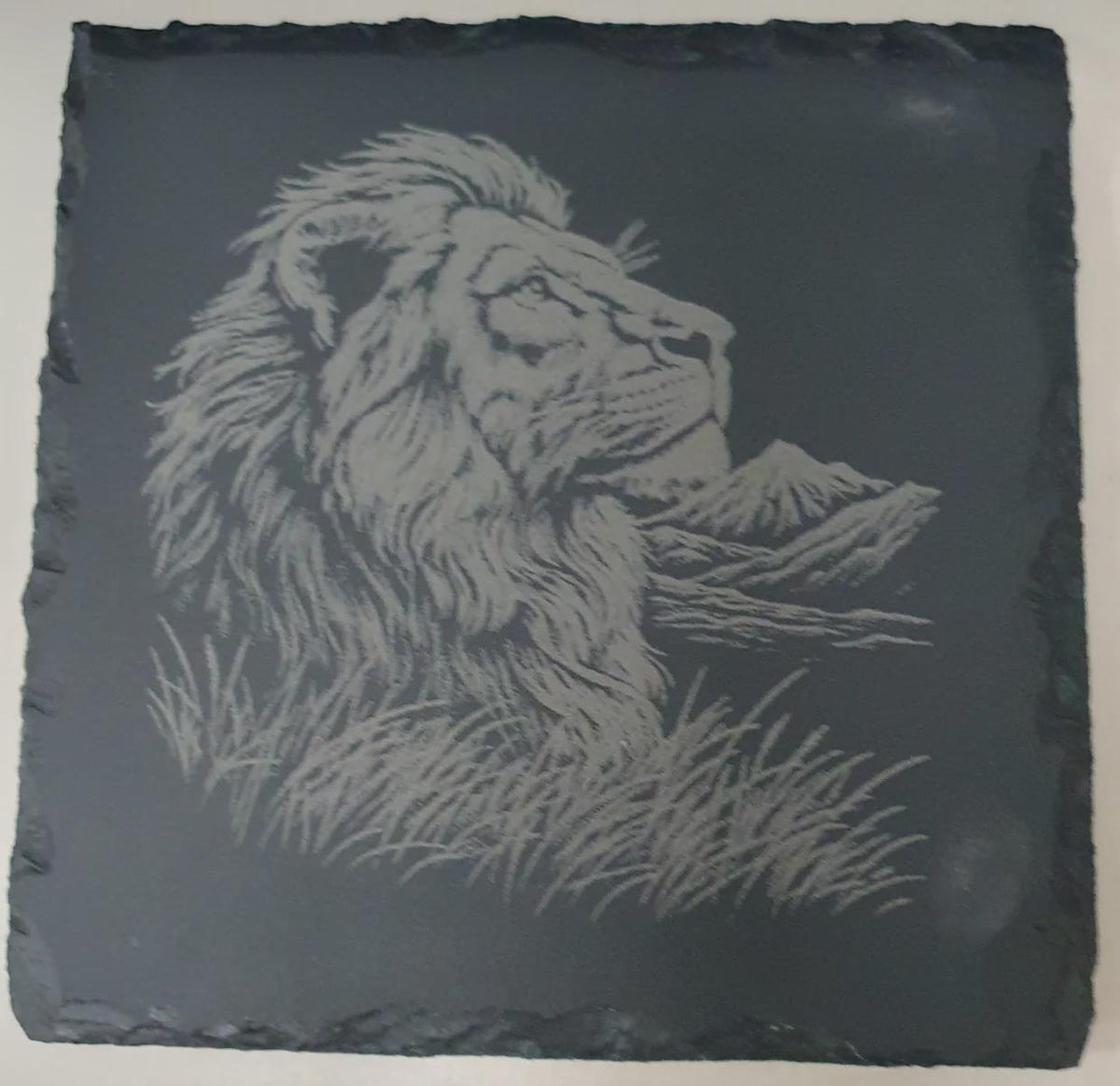 4-piece slate tile set with laser-etched big cat designs, ideal as coasters, décor tiles or art pieces. Durable natural slate tiles with intricate wildlife engraving, perfect animal themed gift and stylish functional slate home accents.