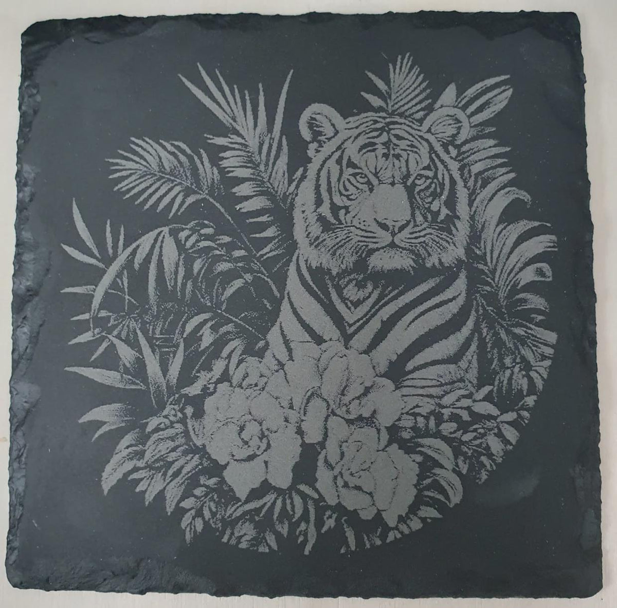 4-piece engraved big cat slate tile set displayed as home décor on shelf or wall, natural stone art tiles for wildlife lovers. Rustic or modern interior décor, animal themed slate set perfect for living room, study or office.