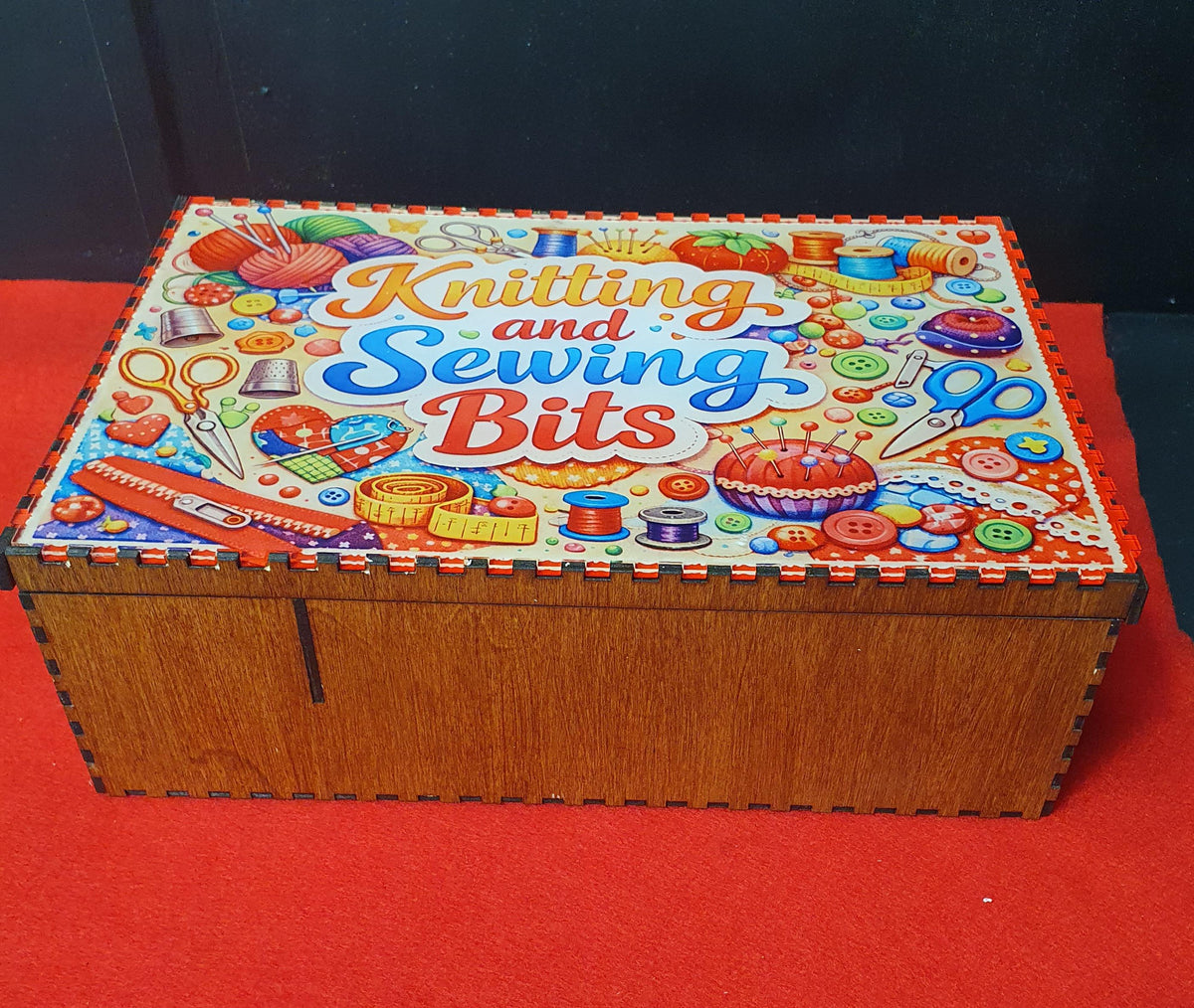 Spacious knitting and sewing storage box interior designed to hold yarn, threads, scissors and accessories