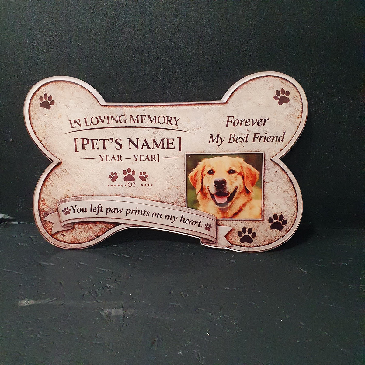 Personalised bone shaped pet memorial plaque for dog or cat with custom photo, name and dates, featuring paw prints and “You left paw prints on my heart” quote, 24cm x 15.5cm remembrance keepsake.