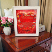 Framed Mother’s Day gift for Mum displayed on wooden dresser with pink roses, featuring red heart floral poem print and Happy Mother’s Day message.