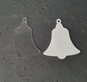 Clear and white acrylic bell blanks displayed side by side showing smooth laser cut edges and optional hanging hole at the top, suitable for sublimation, vinyl and UV printing.