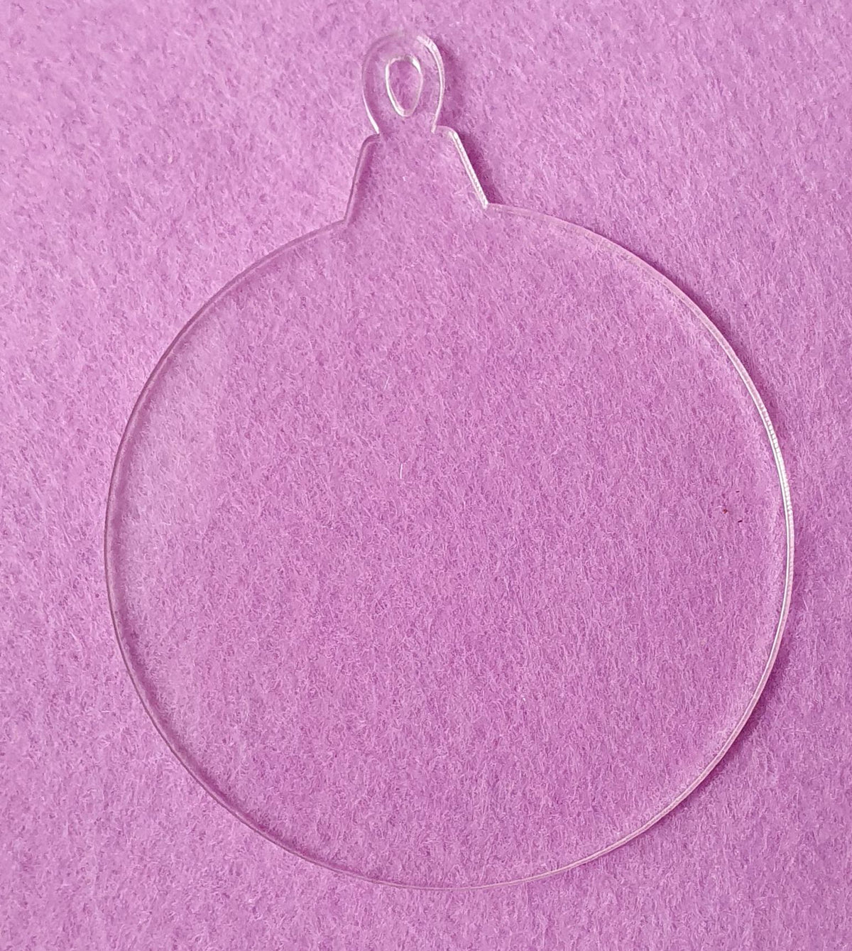 Clear acrylic bauble with white sublimation reverse layer designed to enhance colour vibrancy for sublimation printing and personalised decorations.