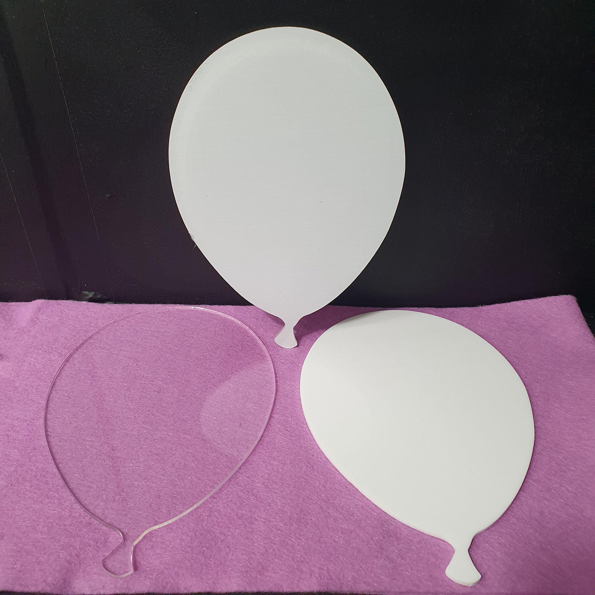 Set of 3mm acrylic balloon blanks in clear, white and clear with white sublimation reverse finishes, measuring 14cm wide by 20cm tall for party and event crafts.