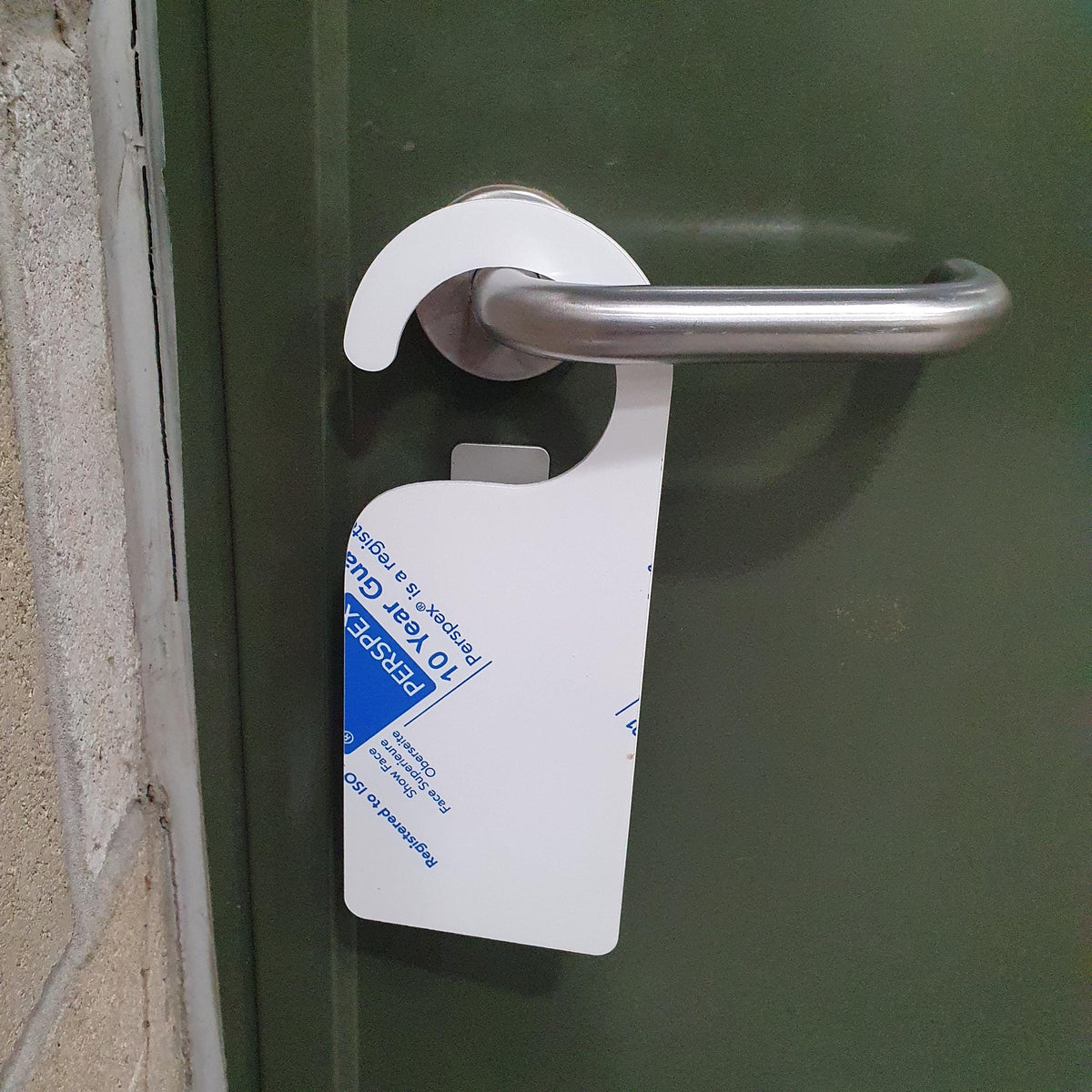 Acrylic door hanger blank displayed hanging on a silver door handle to demonstrate size, fit and suitability for hotel, office or personalised signage use.