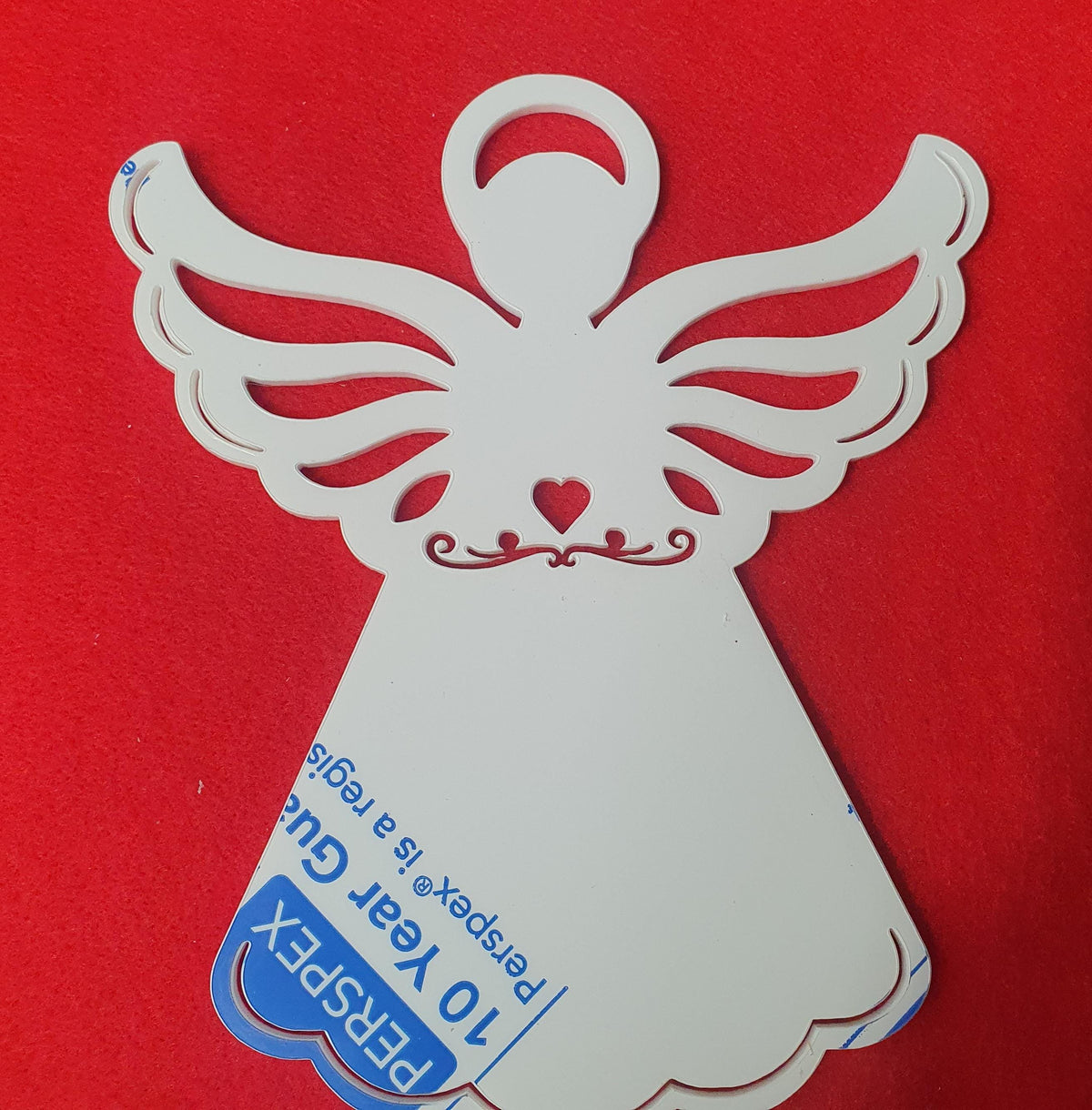 White acrylic angel memorial stake close up showing smooth laser cut edges and heart detail suitable for vinyl and engraving.