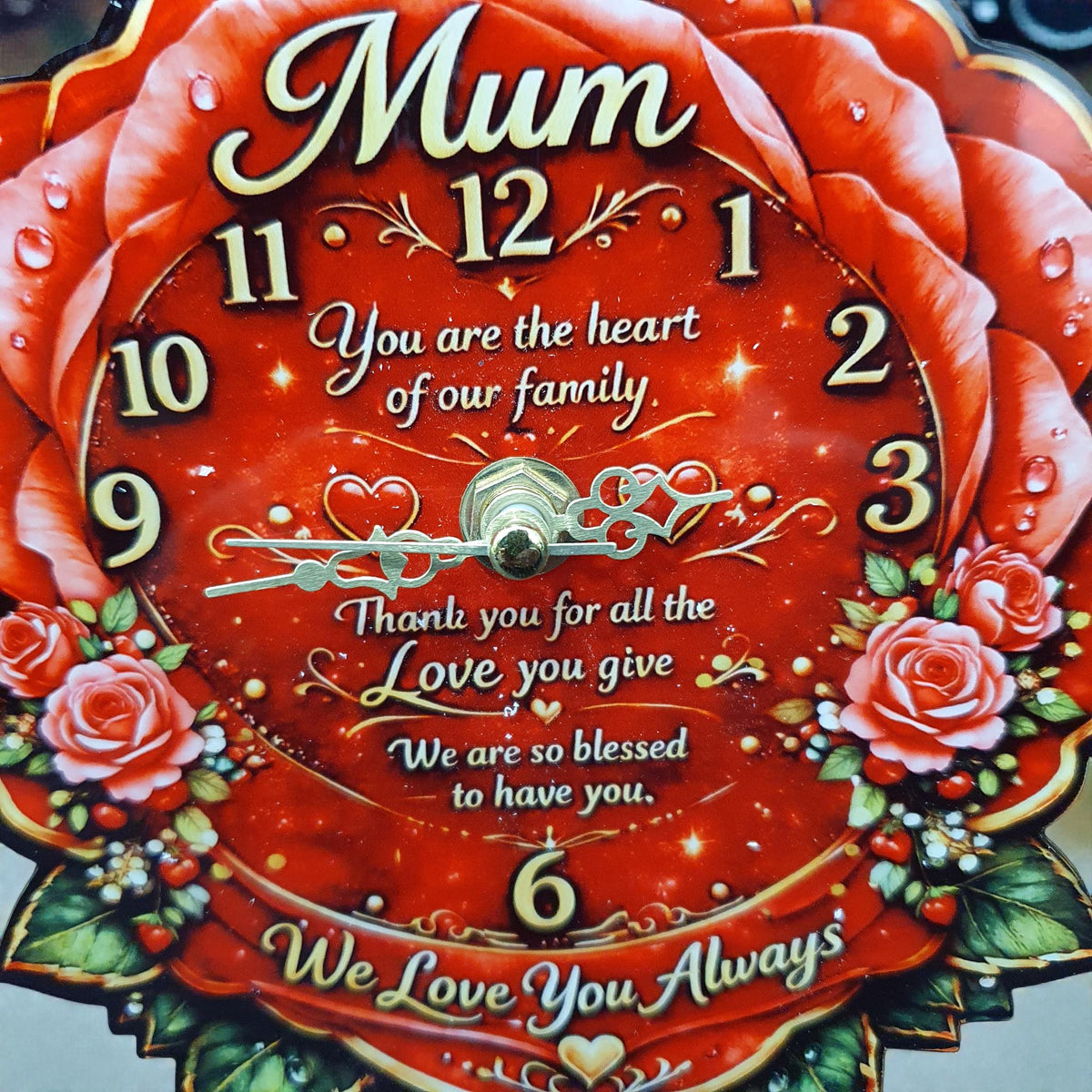 Beautiful rose-shaped Mum clock with vibrant red floral design and gold detailing, featuring heartfelt message and decorative roses.