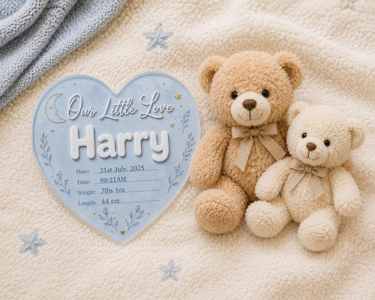 Custom baby boy birth announcement sign with heart shape design, soft blue finish, raised lettering and celestial nursery theme.