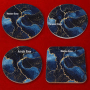 Navy blue marble effect coaster with luxurious gold veins and textured geode-inspired design.