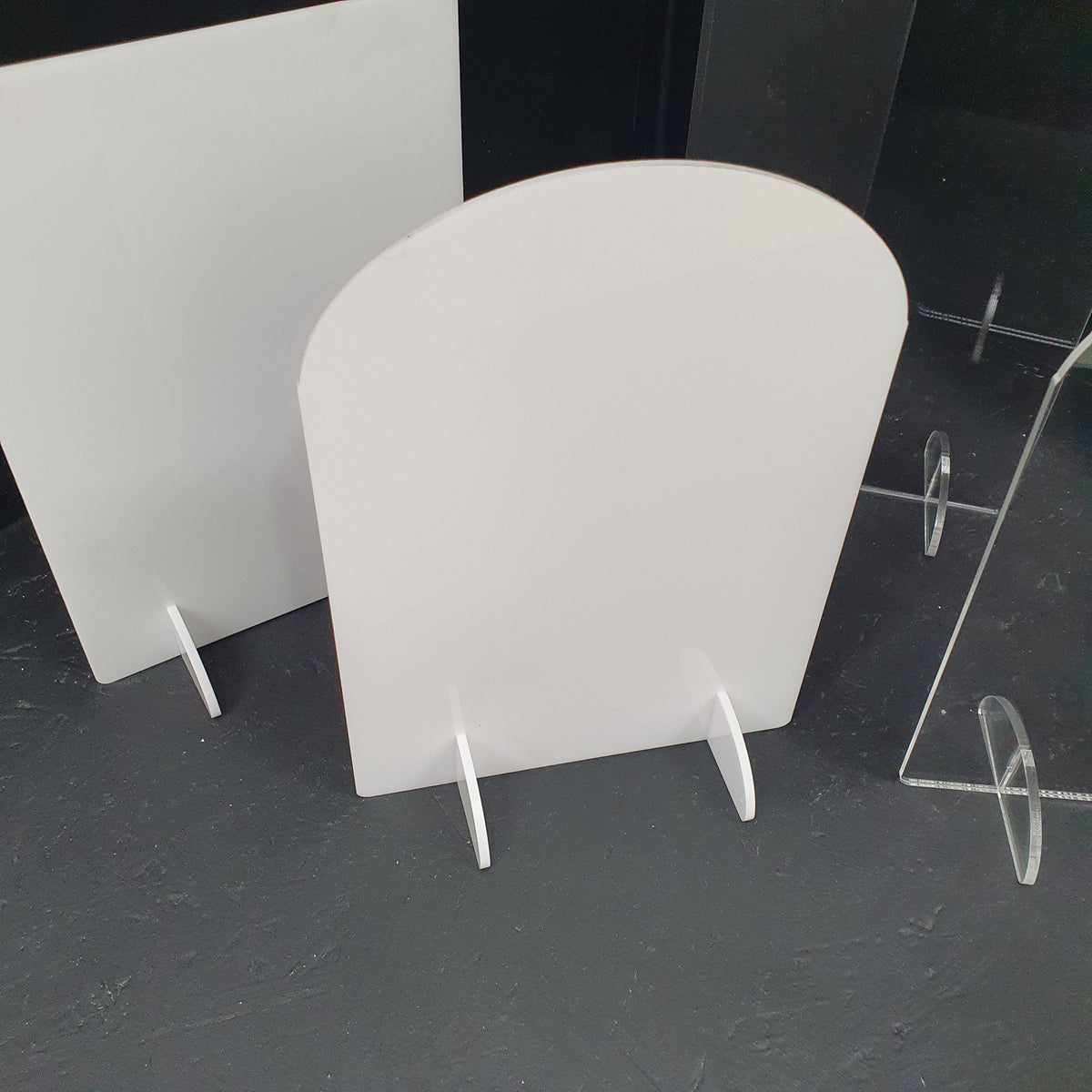 White acrylic rectangle sign blank with rounded corners and freestanding slot base for wedding table numbers.
