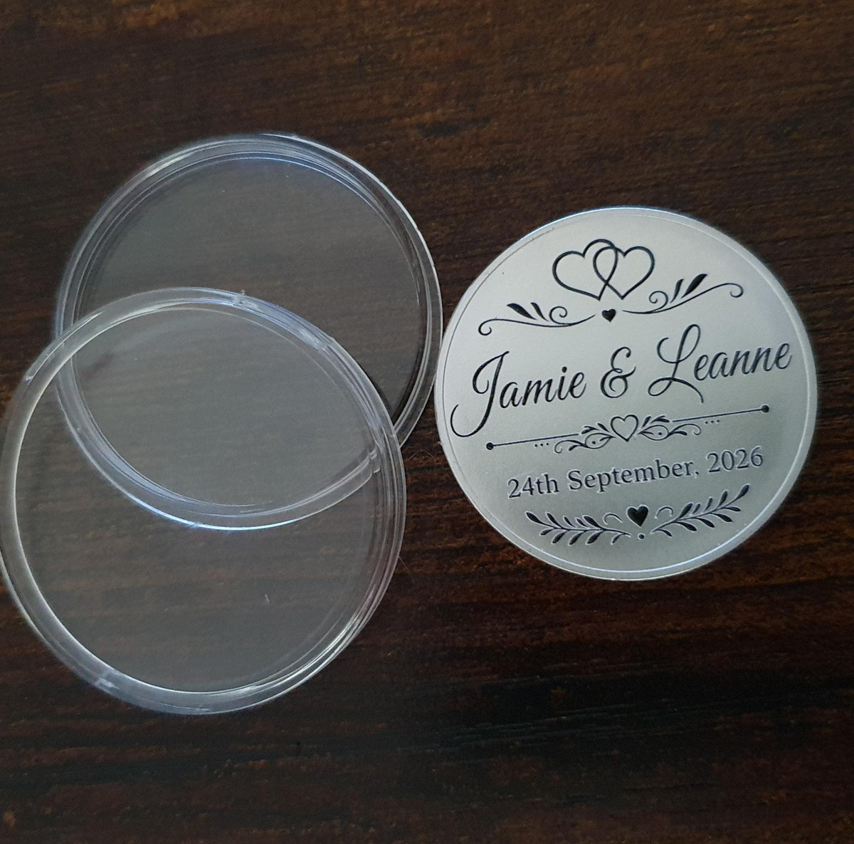 Solid alloy 40mm personalised wedding token displayed in protective acrylic presentation case