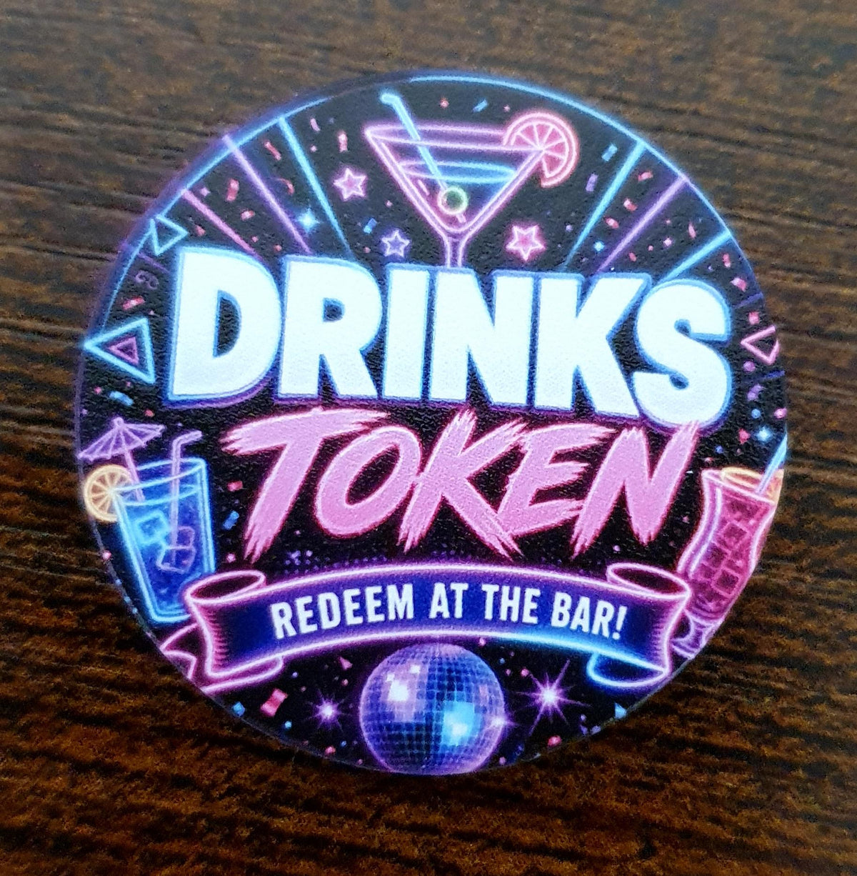 40mm Neon Night Party Drinks Token with colourful glowing cocktail design and "Redeem at the Bar" wording for event drink vouchers.