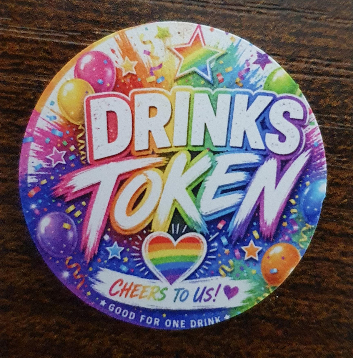 40mm Rainbow Pride Drinks Token featuring colourful rainbow artwork, balloons and "Good For One Drink" design for bar redemption.