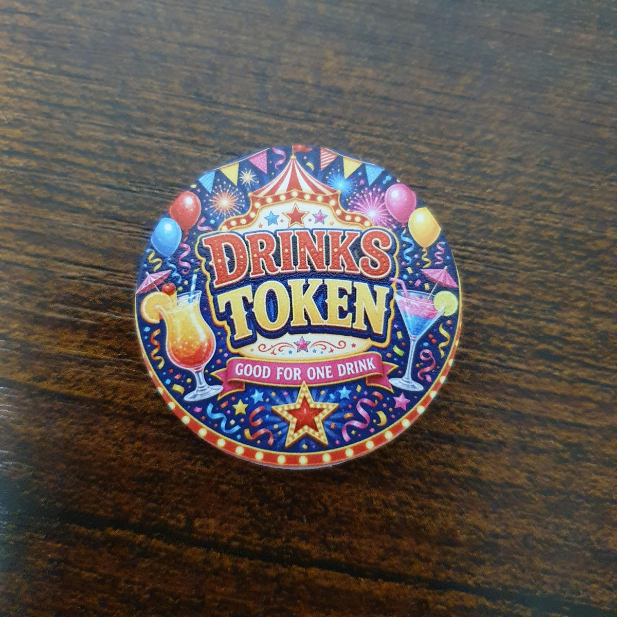 Colourful 40mm Carnival Party Drinks Token featuring "Redeem at Bar" design with festive lights, balloons, fireworks and cocktails.