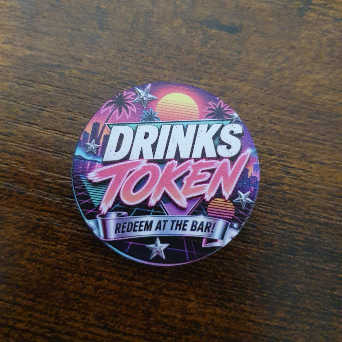 40mm Retro 80s Miami Drinks Token featuring neon sunset, palm trees and synthwave artwork with "Redeem at the Bar" text.