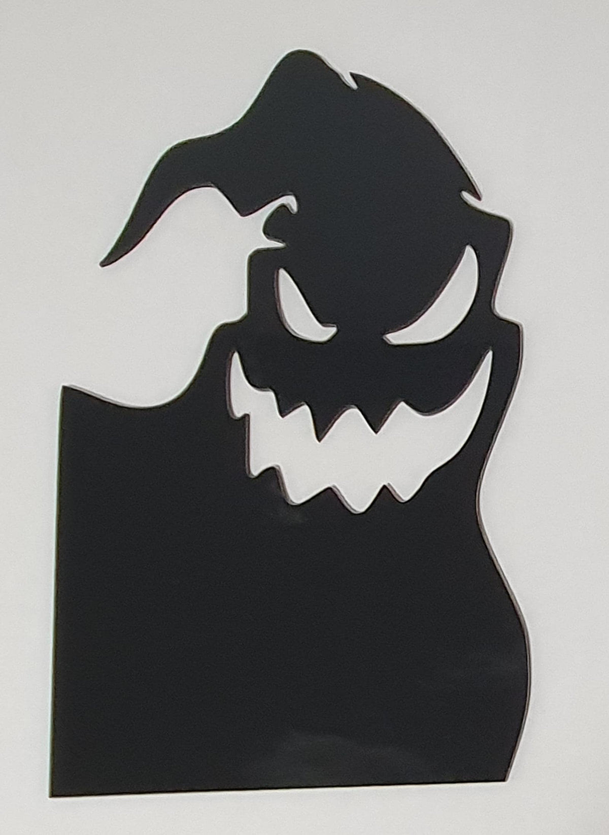 Spooky ghost cutout fitted into a domestic window corner, available in 20 cm, 30 cm and 40 cm tall size options for Halloween decorating.