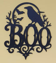 Black laser-cut acrylic BOO Halloween decoration featuring a raven, flying bats, full moon, twisted branches and gothic flourishes.