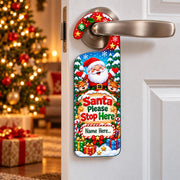 Personalised Santa Please Stop Here Christmas door hanger with Santa, reindeer and a space for a child’s name.