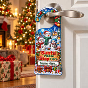 Personalised Santa Please Stop Here door hanger showing three snowmen in a snowy scene, with a space for a child’s name.
