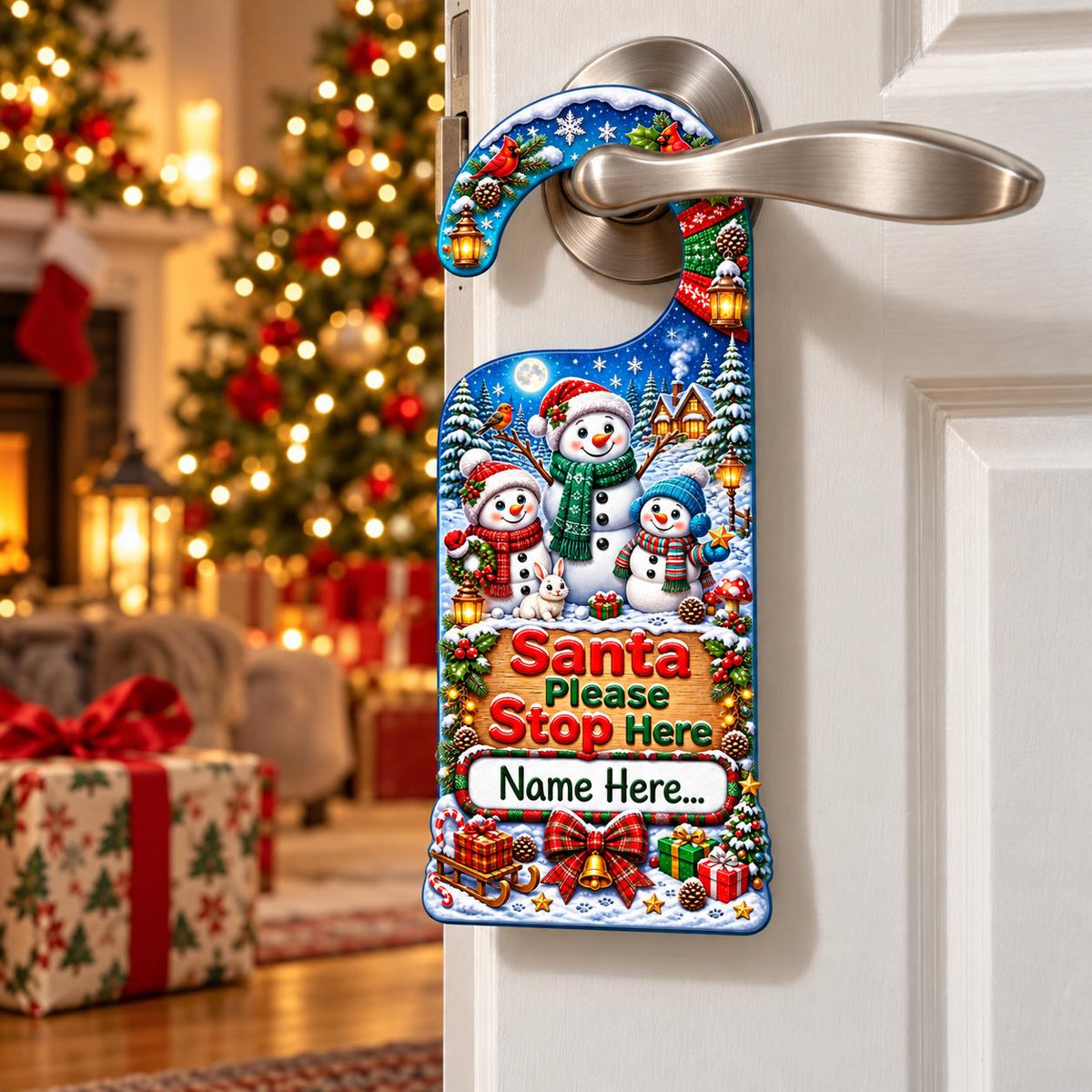 Personalised Santa Please Stop Here door hanger showing three snowmen in a snowy scene, with a space for a child’s name.